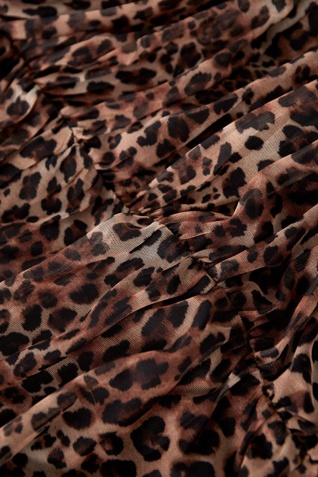 This woven polyester mini dress combines modern aesthetics with functional performance, making it a strong contender in contemporary women's fashion. The elegant cut ensures a refined appearance while maintaining comfort across multiple wear scenarios. Featuring a striking leopard print design, this piece stands out in visual merchandising displays and appeals to customers seeking statement pieces. The ruffle edge at the hem introduces dynamic layering and softens the overall look, enhancing its versatility